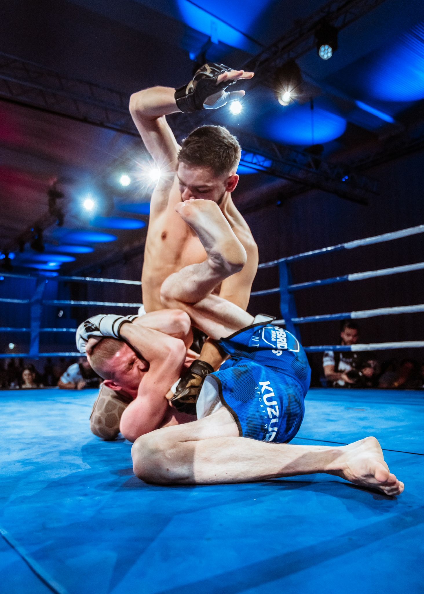 Argjent Shala striking from top position in the cage